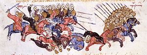 Miniatura medieval que muestra un grupo de jinetes con turbantes persiguiendo a un grupo de caballería fuertemente blindada