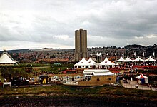 Gateshead Garden Festival was held in 1990 and signalled an emerging arts policy in the borough. Tents, flags and crowds are visible.