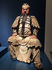 Statue depicting a man in colorful armour