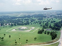View of helicopter flying over Fort Knox