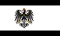 The flag of Prussia (1892–1918), a charged horizontal triband.