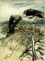 Two black birds in a leafless tree above a grassy landscape with a cloudy sky and dark mountains in the background