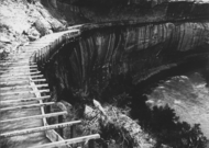 Hanging flume on the lower San Miguel River in 1891. Remnants of the flume may still be seen today. [5]