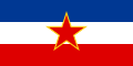 The flag of Yugoslavia, a charged horizontal triband.