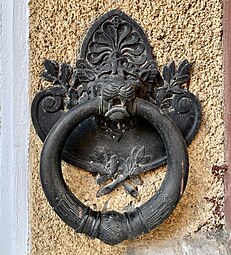 Greek Revival cartouche of a horse tie ring of the Adina and Emil Costinescu House (Strada Polonă no. 4), Bucharest, by Ion D. Berindey, 1911-1915[23]