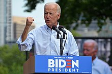 Biden giving a speech at a podium