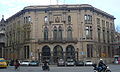 Seu del districte de l'Eixample, a Barcelona, obra de Pere Falqués, amb tres arcs ogivals el central dels quals és lleugerament més obtús que els altres dos.