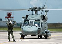 A Helicopter Anti-Submarine Squadron (HS) 11 prepares to take off.