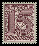 rechteckige Briefmarke der einer großen Zahl „15“ und darunter dem Wort „Dienstmarke“ in rot