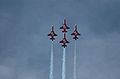 Cuatro F-5E de la Patrouille Suisse volando en formación.