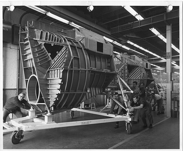 Two Grumman Aircraft Engineering Corporation Lunar Module ascent stage fuselages being moved to final assembly.