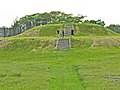 Image 33The largest platform mound at Aztalan, with modern reconstructions of steps and stockade (from History of Wisconsin)