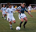 Image 2Mia Hamm (left) battles with German defender Kerstin Stegemann (from Women's association football)