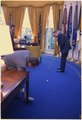 President Richard M. Nixon and Bob Hope play golf in the Oval Office.
