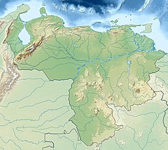 Mapa konturowa Wenezueli, u góry po lewej znajduje się owalna plamka nieco zaostrzona i wystająca na lewo w swoim dolnym rogu z opisem „Maracaibo”