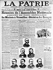 Une en noir et blanc d’un journal comportant les portraits de sept hommes, moustachus et/ou barbus