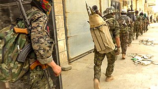 A column of IRPGF fighters during the Battle of Tabqa