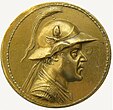 Eucratides the Great wearing the Bactrian version of the Boeotian helmet, shown on his gold 20-stater, the largest gold coin ever minted in the ancient world, c. 2nd century BC. of Greco-Bactrian Kingdom Bactrian Kingdom Greco-Bactria Graeco-Bactria