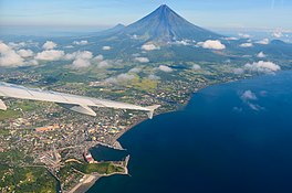 An aerial view of the gulf beside Legazpi City with Mayon Volcano in the background