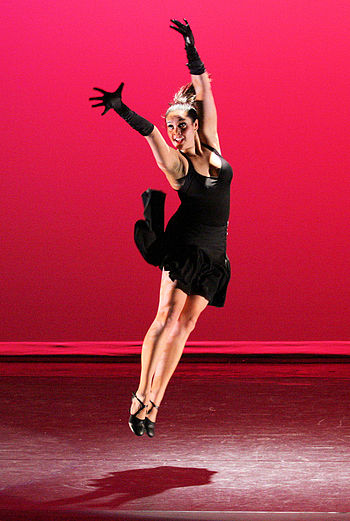 A tap dancer jumping into the air