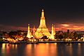 Image 17Wat Arun, the most prominent temple of the Thonburi period, derives its name from the Hindu god Aruṇa. Its main prang was constructed later in the Rattanakosin period. (from History of Thailand)