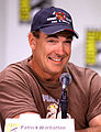 Patrick Warburton interpreta Rick Stoner