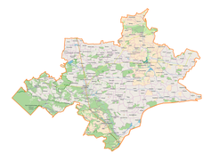 Mapa konturowa powiatu tomaszowskiego, na dole znajduje się punkt z opisem „Obóz zagłady w Bełżcu”