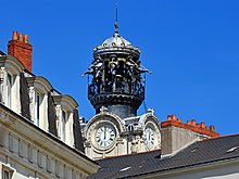 Ornate church belfry against a blue sky