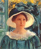Nuori nainen ulkona vihreässä puvussa, vuodelta 1914