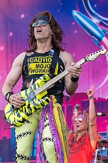 Satchel performing with Steel Panther in 2023
