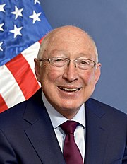 Photograph of Colorado senator Ken Salazar in front of an American flag