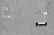 The group of lines running up and down in the image are believed to be deformation bands. They can be thought of as small faults.