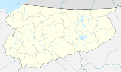 Mapa konturowa województwa warmińsko-mazurskiego, u góry nieco na lewo znajduje się punkt z opisem „Parafia Świętego Jerzego”