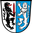 Gemeinde Babensham Gespalten von Silber und Blau, vorne ein schwarzer, rot bezungter Löwe mit einem roten Schwert in den Pranken, hinten ein herschauender silberner Löwe.
