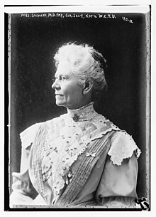 black and white portrait photograph of white-haired old woman