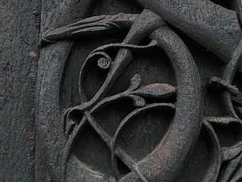 Detail of carving on the left jamb of the north door