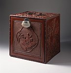 Japanese chest with cartouche showing figures on donkeys in a landscape; 1750–1800; carved red lacquer on wood core with metal fittings and jade lock; 30.64 x 30.16 x 12.7 cm; Los Angeles County Museum of Art (USA)