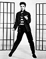 Image 7The 1950s were the true birth of the rock and roll music genre, led by figures such as Elvis Presley (pictured), Chuck Berry, Buddy Holly, Jerry Lee Lewis and others. (from 1950s)