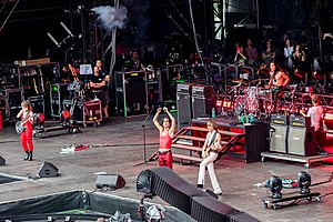 Måneskin performing at Rock am Ring in 2022; from left to right: Victoria De Angelis, Damiano David, Thomas Raggi, and Ethan Torchio