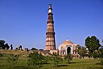 The Qutab Archaeological area (Qutb complex) as now fenced in, including the Mosque, Iron Pillar, Minar of Qutab-din, unfinished Minar, all colonnads, screen arches, tomb of Altmash, college, buildings of Aluddin, Tomb of Imam Zamin and all carved stones in the above area with gardens, paths and water channels, and all gateways including the Alai-Darwaza, also all graves in the above area. Built 1193 - 1245 A.D.