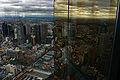 Looking north-east over Melbourne CBD from Skydeck 88, with reflections in the tower's gold plated windows