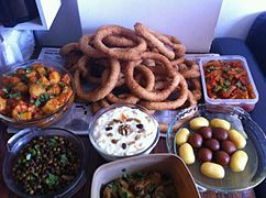 Sel roti with various Nepalese curries and sweets