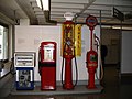 Display of various antique fuel pumps at Deutsches Museum in Munich, Germany.