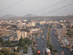 A view of modern Manjil; the wind power generators are seen in the background