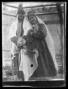 Two women in Turkmen dress