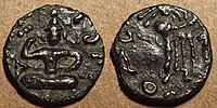 Coin of Kujula Kadphises. Obv Kujula seated cross legged facing, Kharoshti legend: Kuyula Kadaphasa Kushanasa. Rev Zeus on the reverse,[8] Greek legend: ΚΟΖΟΛΑ XOPANOY ZAOOY.