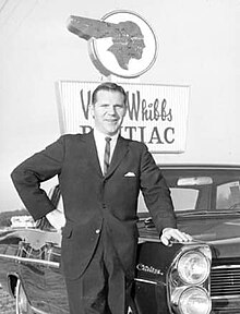 Whibbs portrait in front of Vince Whibbs Pontiac Dealership