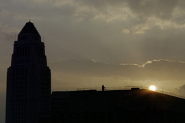 The silhouette of City Hall at sunrise.