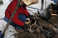 Demonstration of Native American technique of making maple sugar