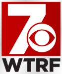 A white 7 in a red box, partially masked by the CBS eye logo. Beneath it and on a silver background are dark gray letters WTRF in a sans serif.